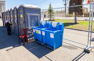Line of porta potties next to a hand washing station in Cleveland Oh